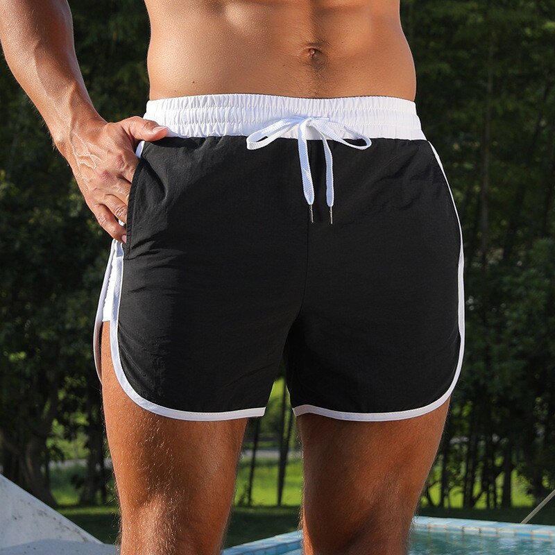 NEW Joggers Shorts Men swim sport shorts Gyms Fitness Bodybuilding Workout Quick Dry Beach Shorts Male Summer Running shorts men